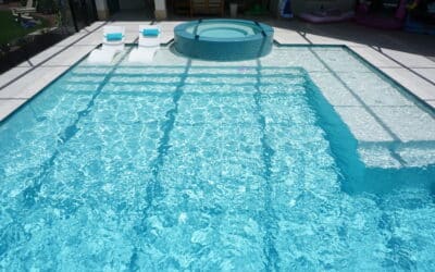 How does a salt cell generate chlorine in swimming pools?